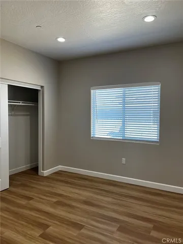 a bathroom with a bathtub shower sink vanity and toilet