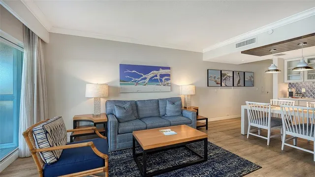 a living room with furniture and a rug