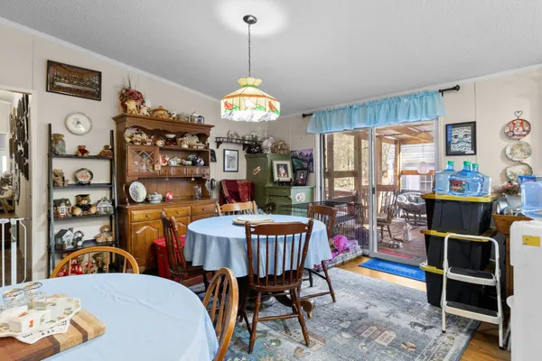 a view of a dining room with furniture window and outside view