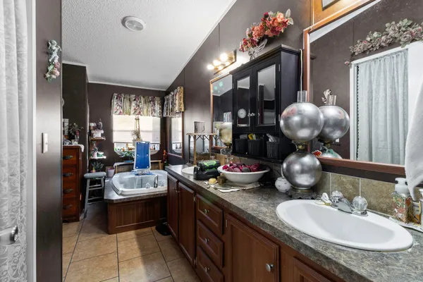 a bathroom with a sink double vanity and a mirror
