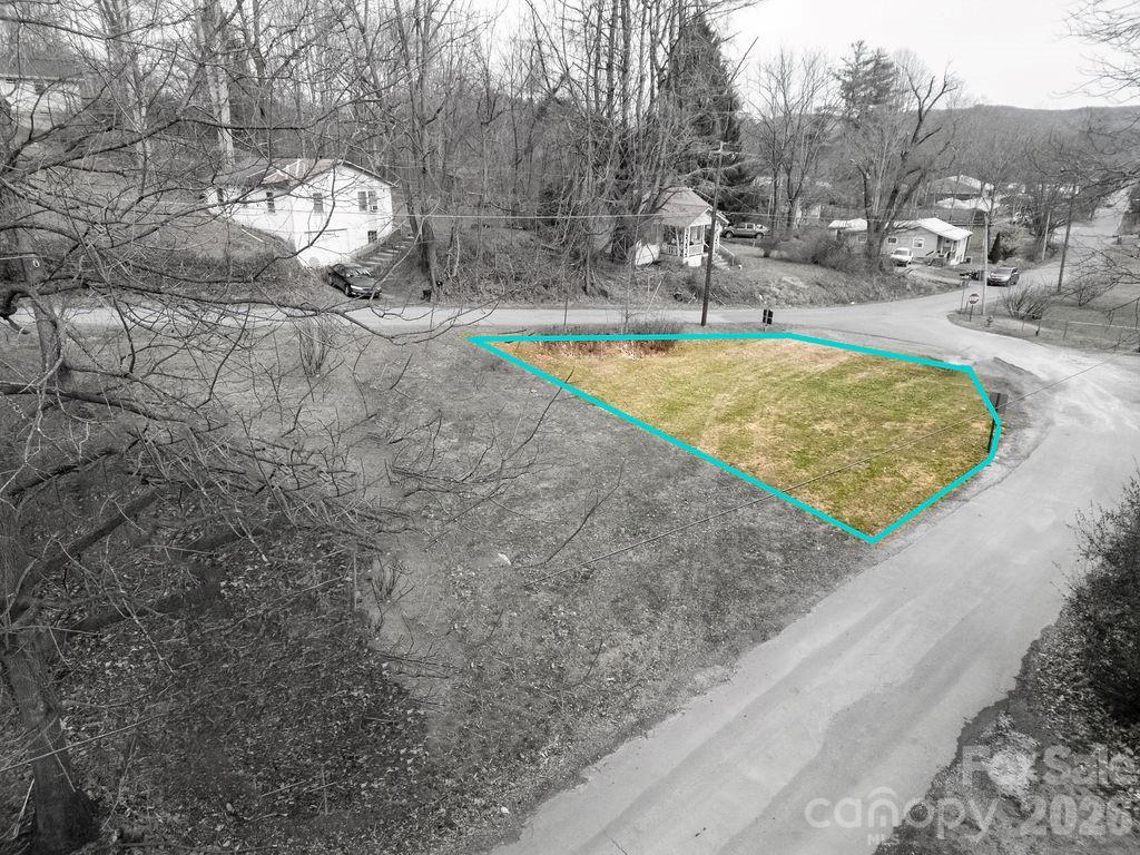 10 Hampton Road, Unit 1 Brevard, NC 28712 - Photo 5 of 9 a view of a swimming pool with a yard and seating area