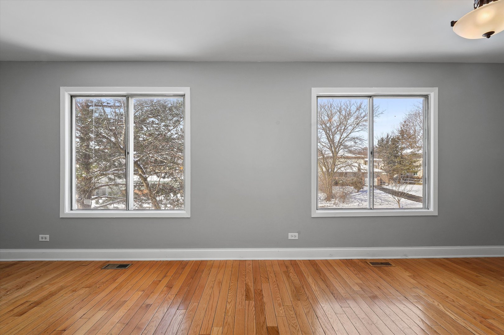 210 Mill Stream Drive Bolingbrook, IL 60440 - Photo 11 of 39 an empty room with wooden floor and windows