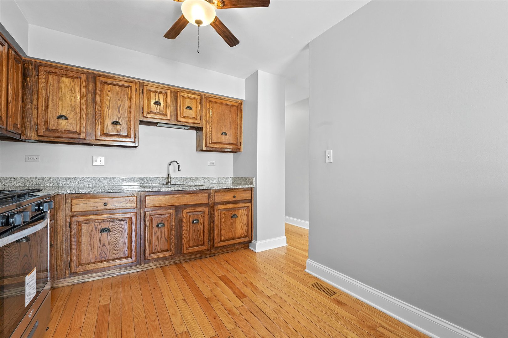 210 Mill Stream Drive Bolingbrook, IL 60440 - Photo 16 of 39 a spacious bathroom with stainless steel appliances granite countertop a sink and wooden floor