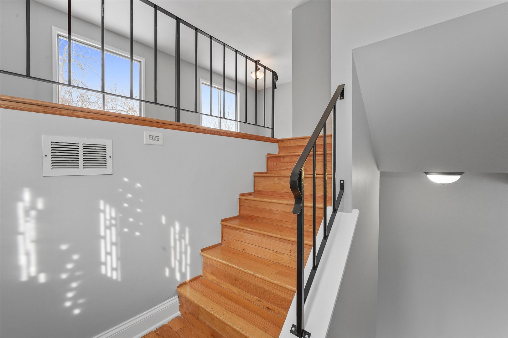 210 Mill Stream Drive Bolingbrook, IL 60440 - Photo 17 of 39 a view of staircase with lots of frames on wall and stairs