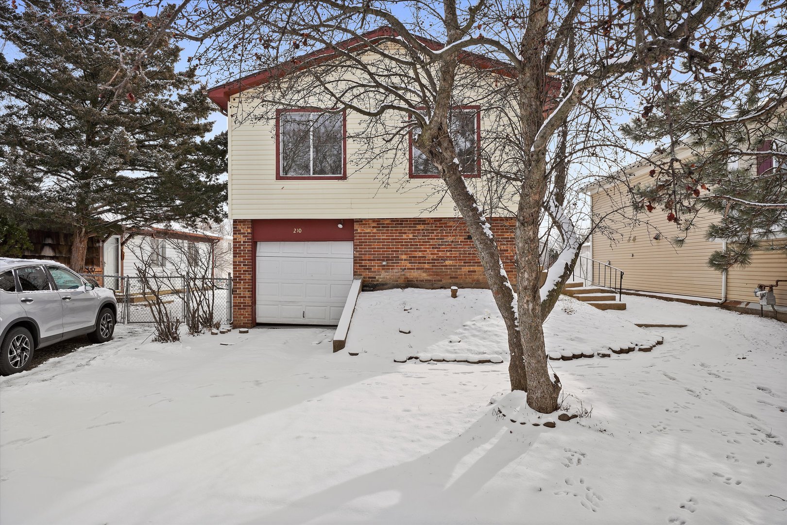 210 Mill Stream Drive Bolingbrook, IL 60440 - Photo 2 of 39 a view of a house with a snow in the yard