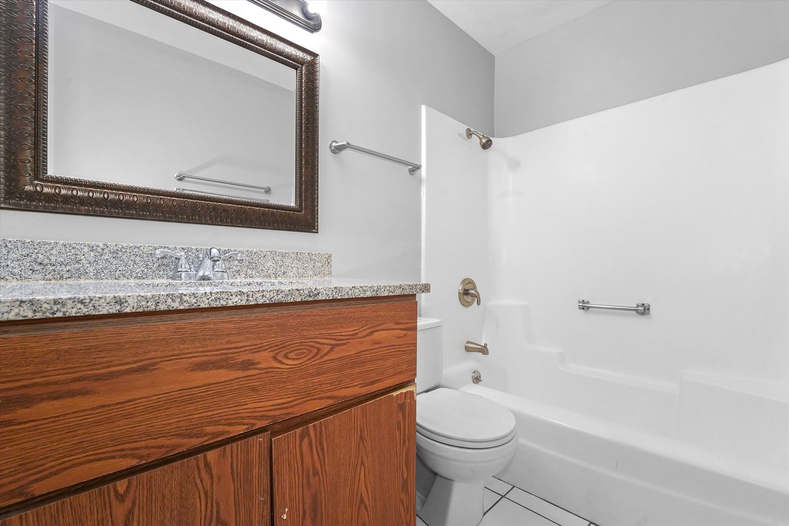 210 Mill Stream Drive Bolingbrook, IL 60440 - Photo 27 of 39 a bathroom with a granite countertop bathtub sink vanity mirror and toilet
