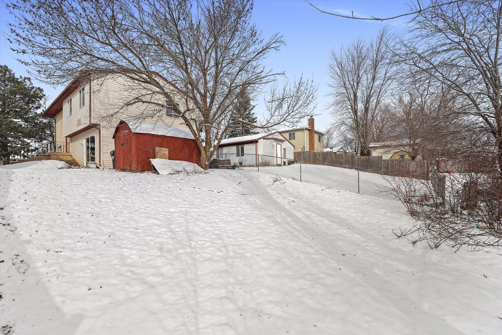 210 Mill Stream Drive Bolingbrook, IL 60440 - Photo 6 of 39 a street view covered with snow