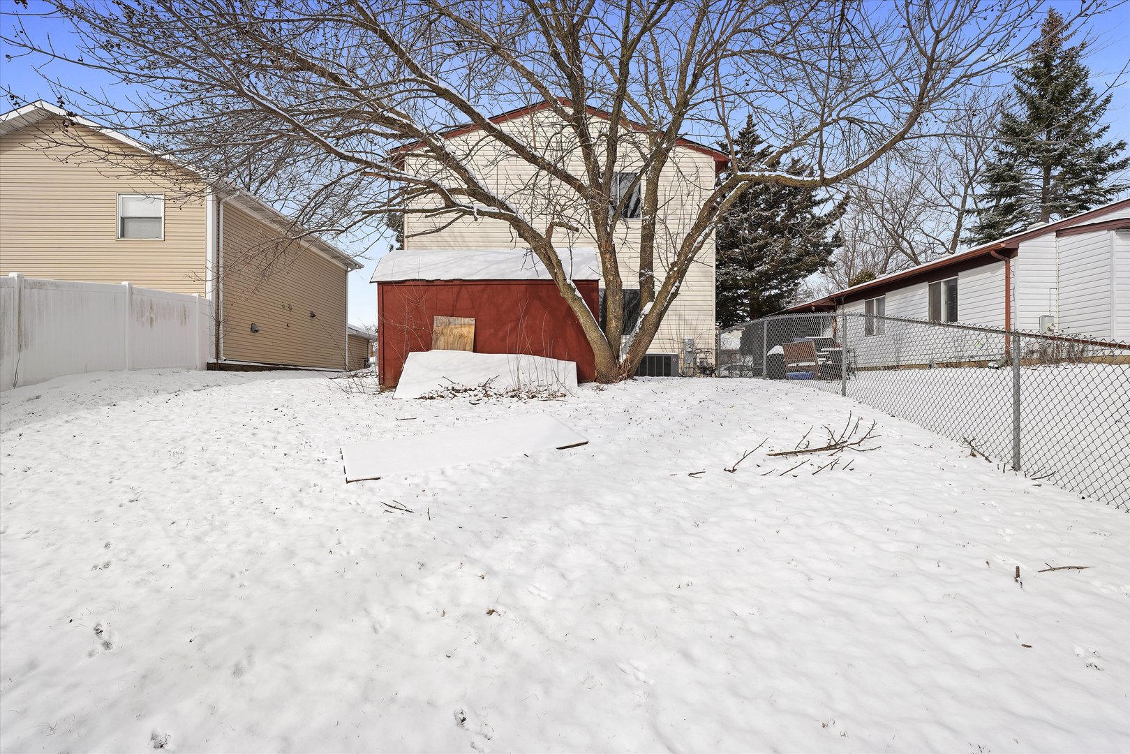210 Mill Stream Drive Bolingbrook, IL 60440 - Photo 7 of 39 a street view covered with snow