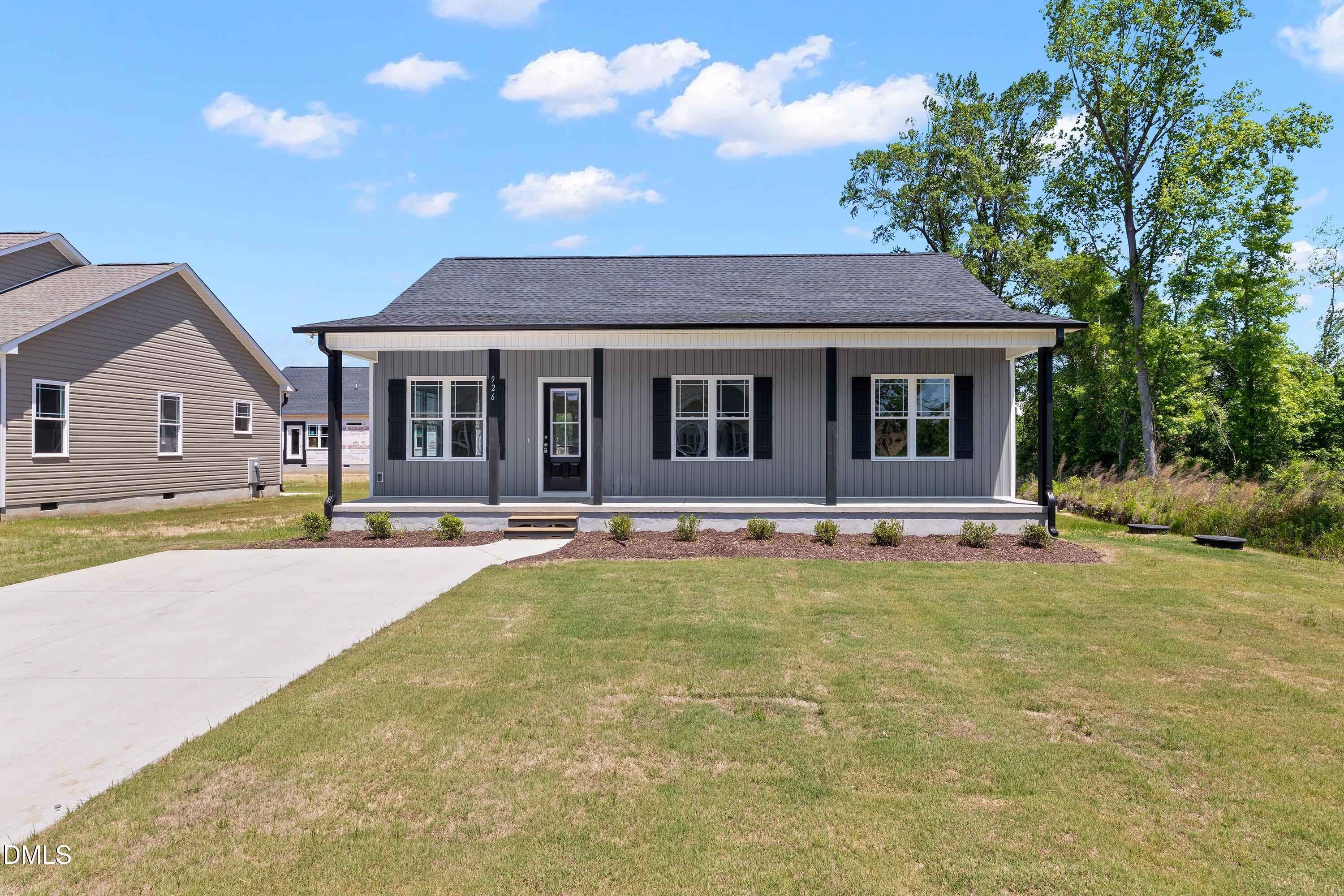 926 Micro Road West Selma, NC 27576 - Photo 2 of 41 a view of a house with swimming pool and a yard