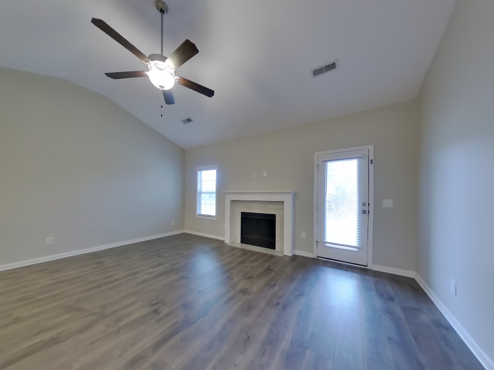 825 Ellyson Drive Spring Hill, TN 37174 - Photo 2 of 17 an empty room with wooden floor fireplace and windows