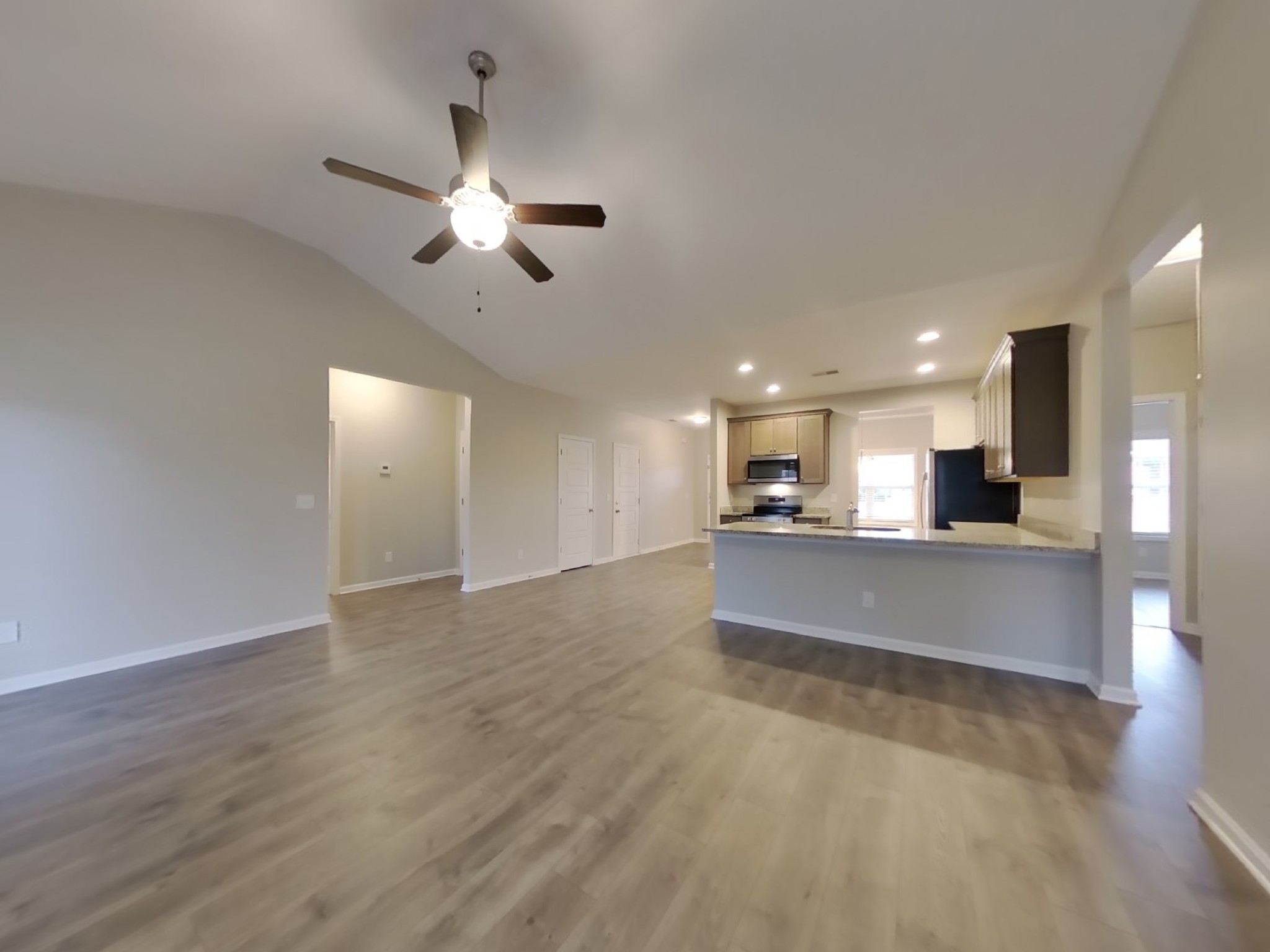 825 Ellyson Drive Spring Hill, TN 37174 - Photo 3 of 17 a view of kitchen with refrigerator microwave and stove