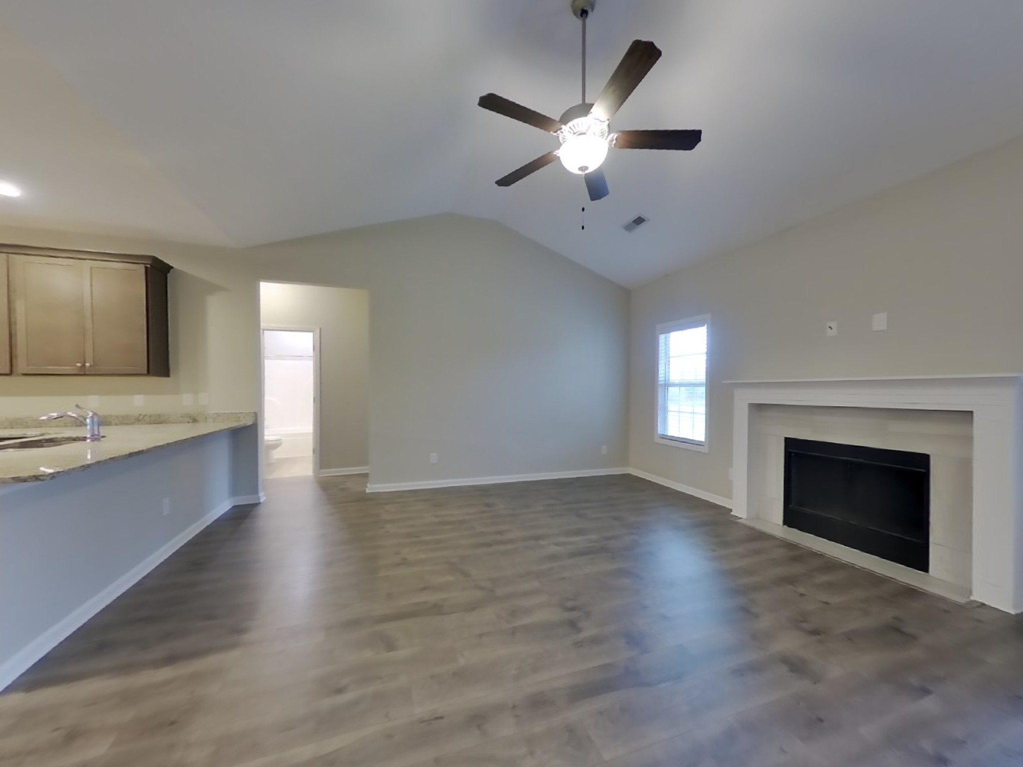 825 Ellyson Drive Spring Hill, TN 37174 - Photo 4 of 17 an empty room with a fireplace and sink