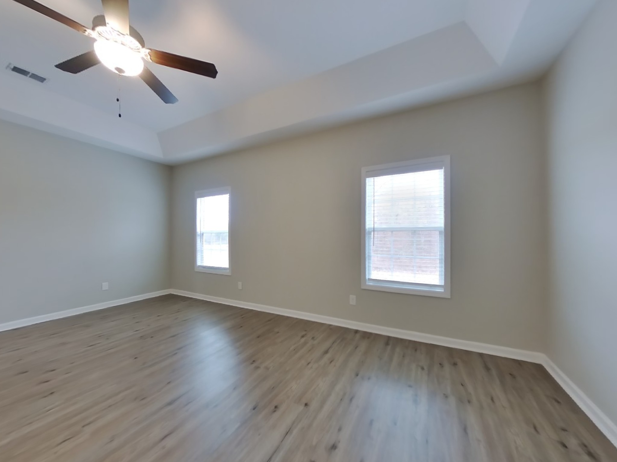 825 Ellyson Drive Spring Hill, TN 37174 - Photo 9 of 17 an empty room with wooden floor chandelier fan and windows