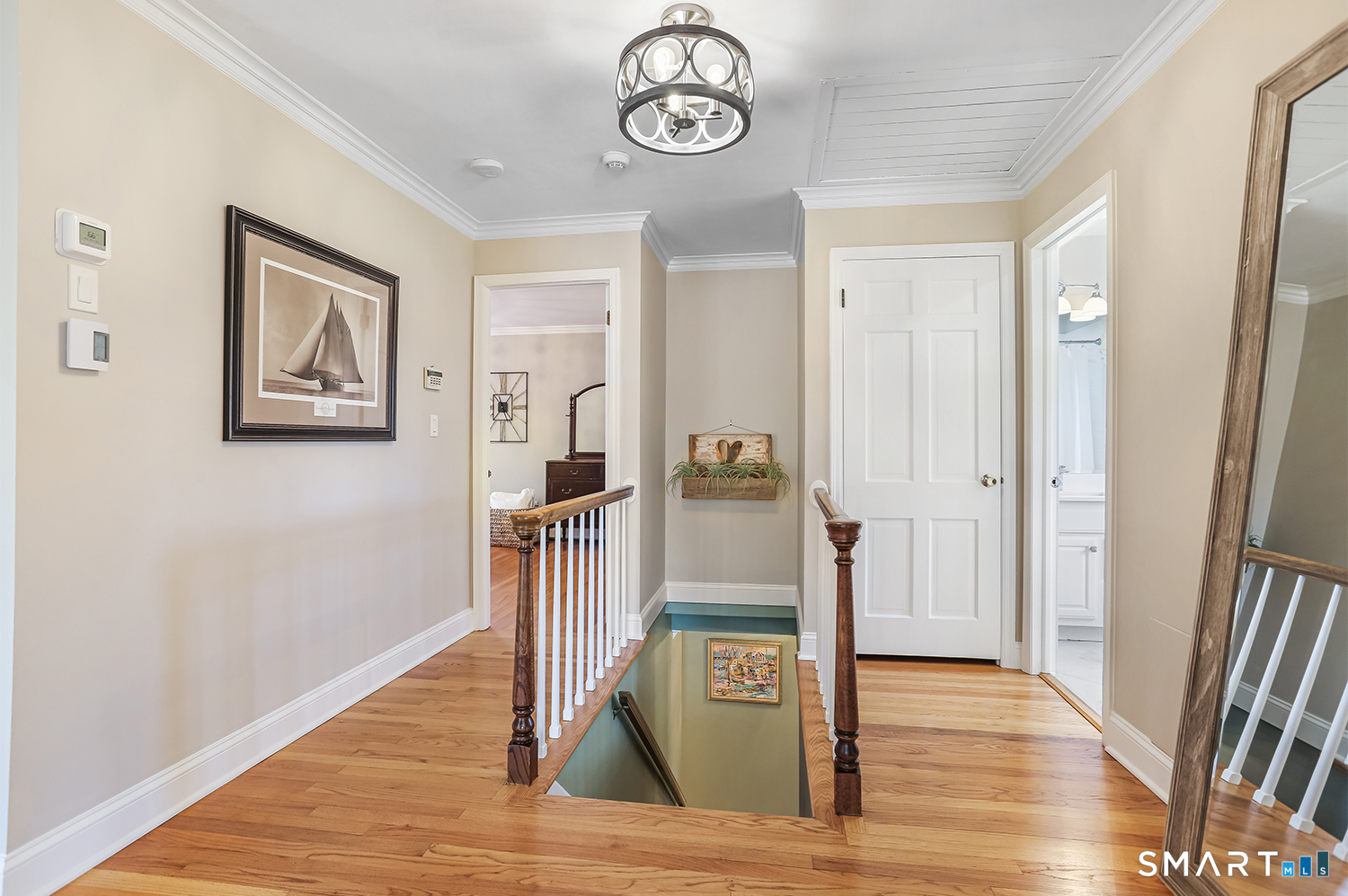 757 Galloping Hill Road Fairfield, CT 06824 - Photo 18 of 30 a view of a hallway with wooden floor