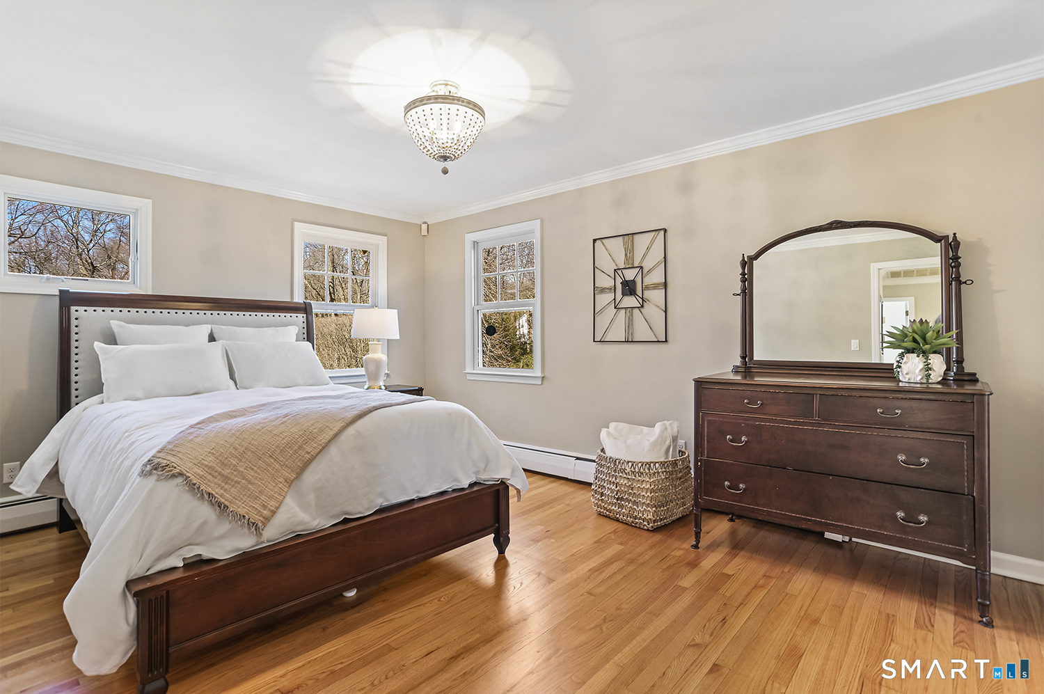 757 Galloping Hill Road Fairfield, CT 06824 - Photo 19 of 30 a bedroom with a bed and a dresser