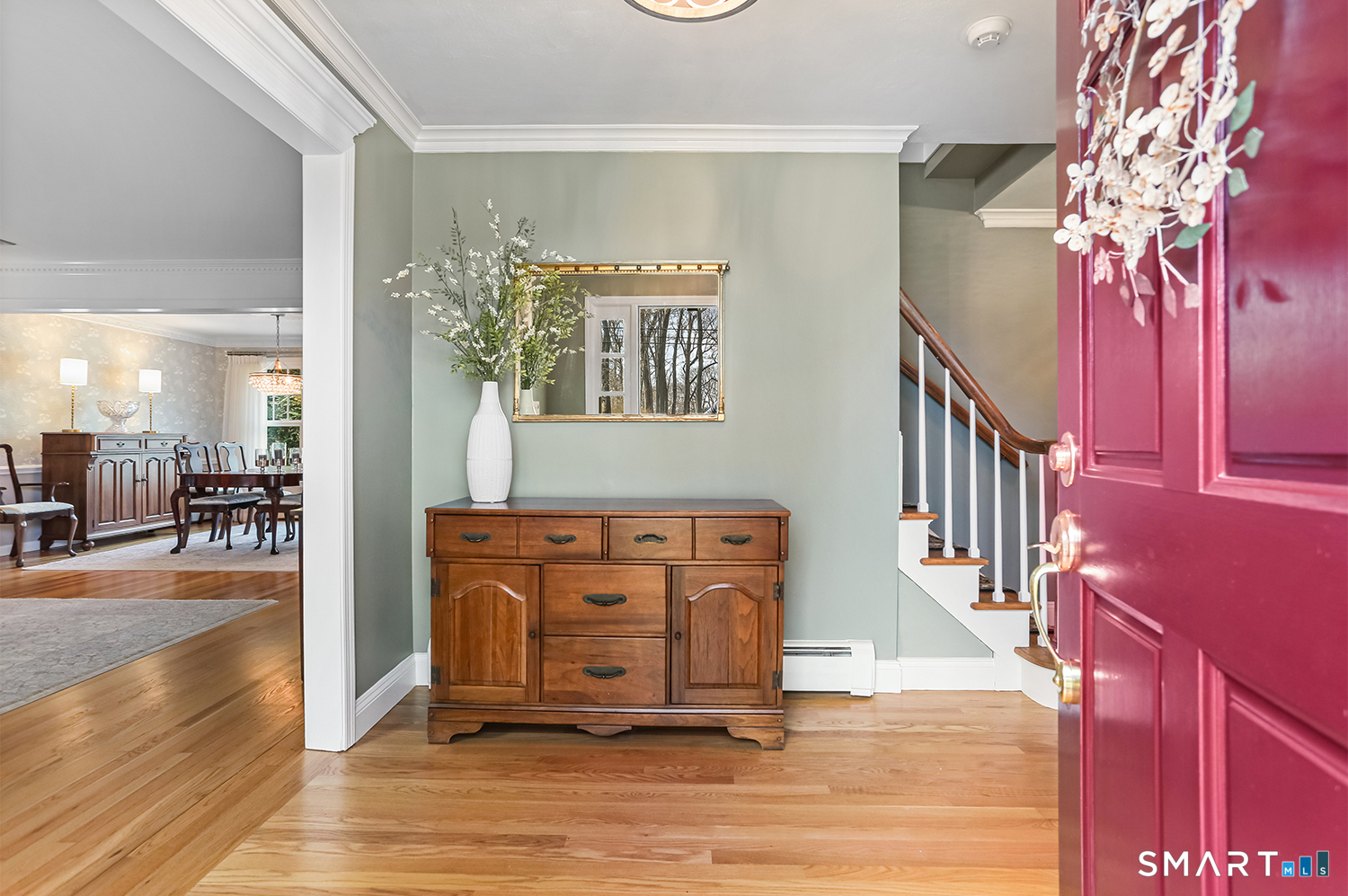 757 Galloping Hill Road Fairfield, CT 06824 - Photo 2 of 30 a view of a hallway with wooden floor and staircase