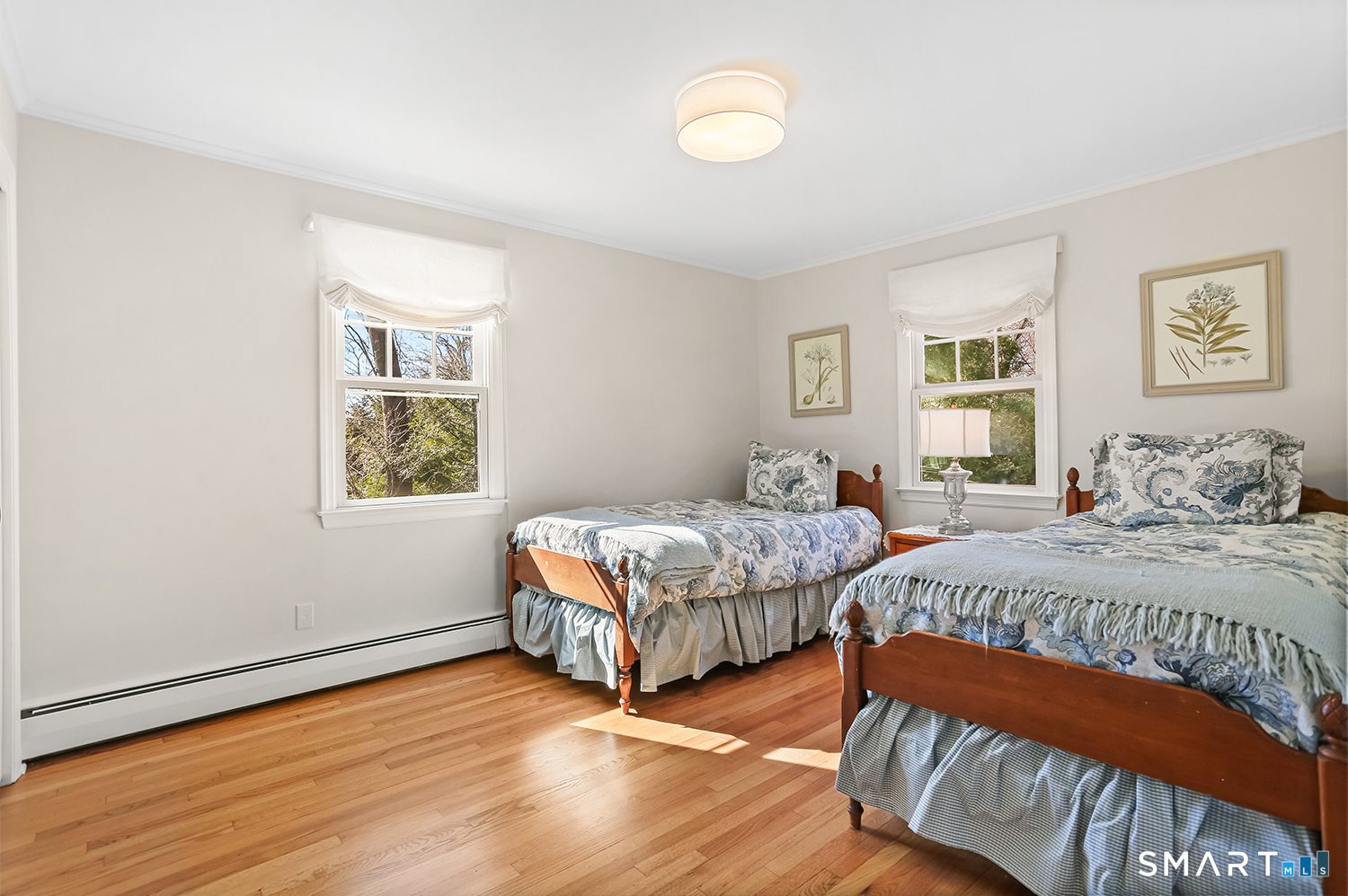 757 Galloping Hill Road Fairfield, CT 06824 - Photo 23 of 30 a bedroom with a bed and a window