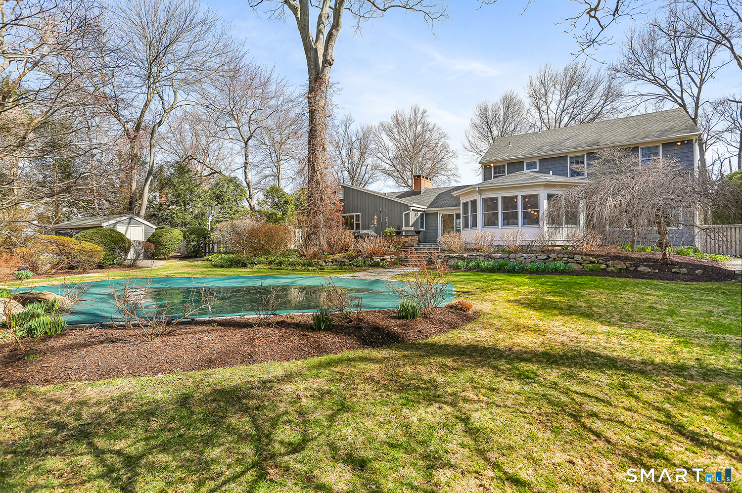 757 Galloping Hill Road Fairfield, CT 06824 - Photo 27 of 30 a house view with swimming pool and green space