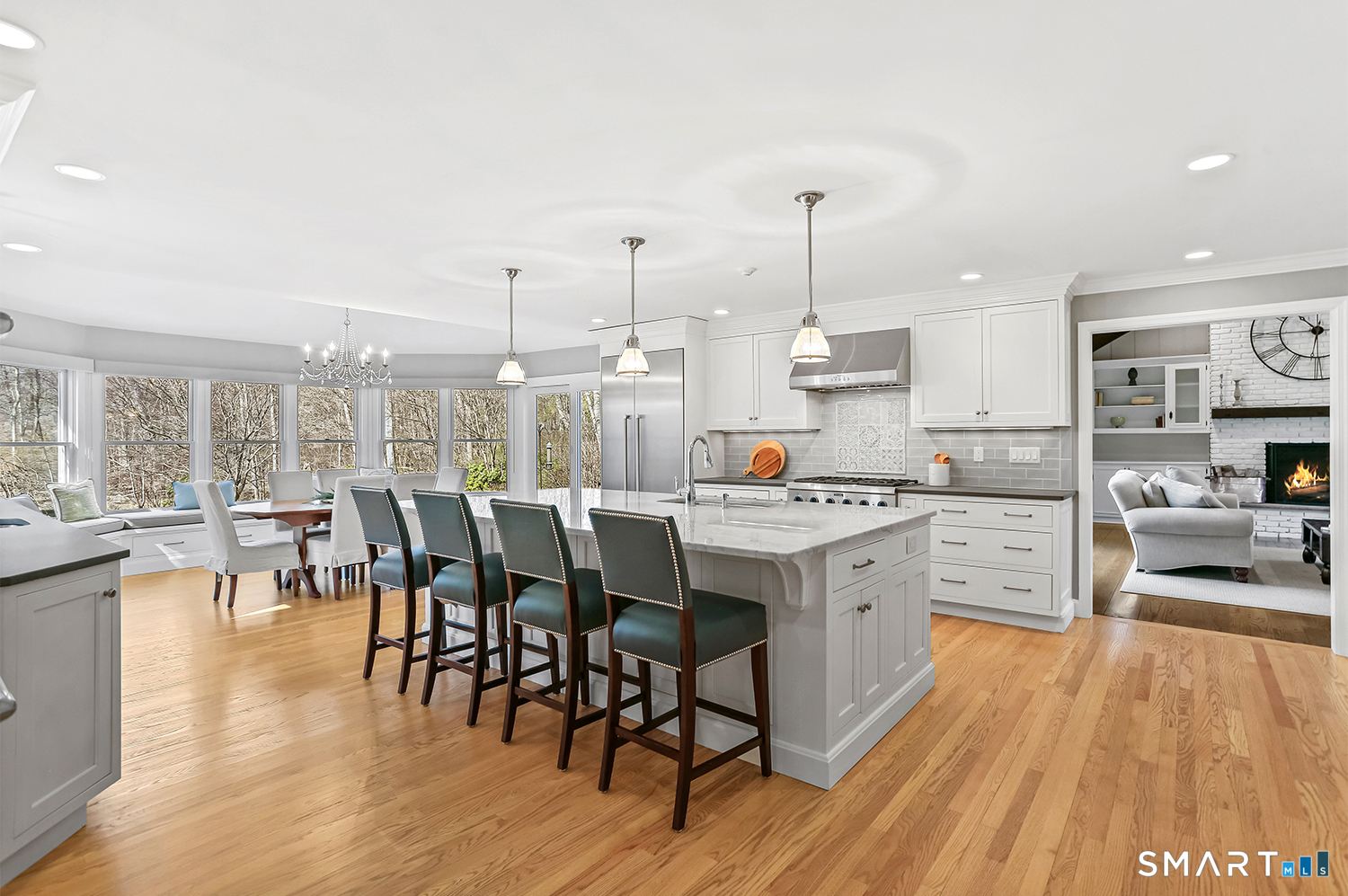 757 Galloping Hill Road Fairfield, CT 06824 - Photo 4 of 30 a kitchen with appliances wooden floor and a view of living room