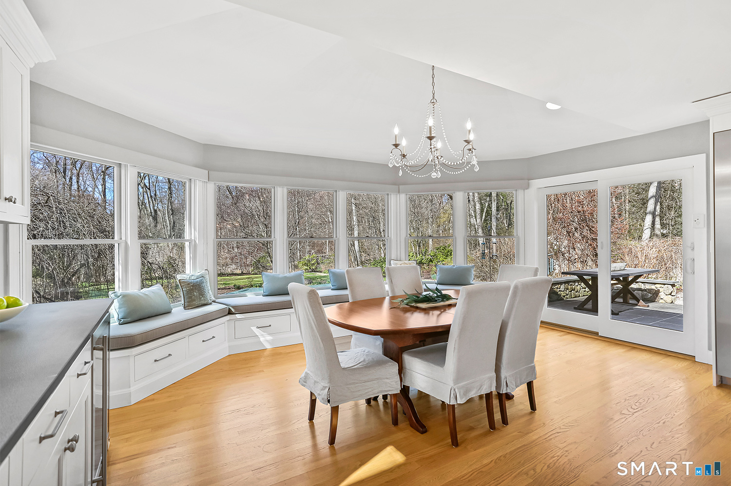 757 Galloping Hill Road Fairfield, CT 06824 - Photo 5 of 30 a dining room with furniture a chandelier and wooden floor