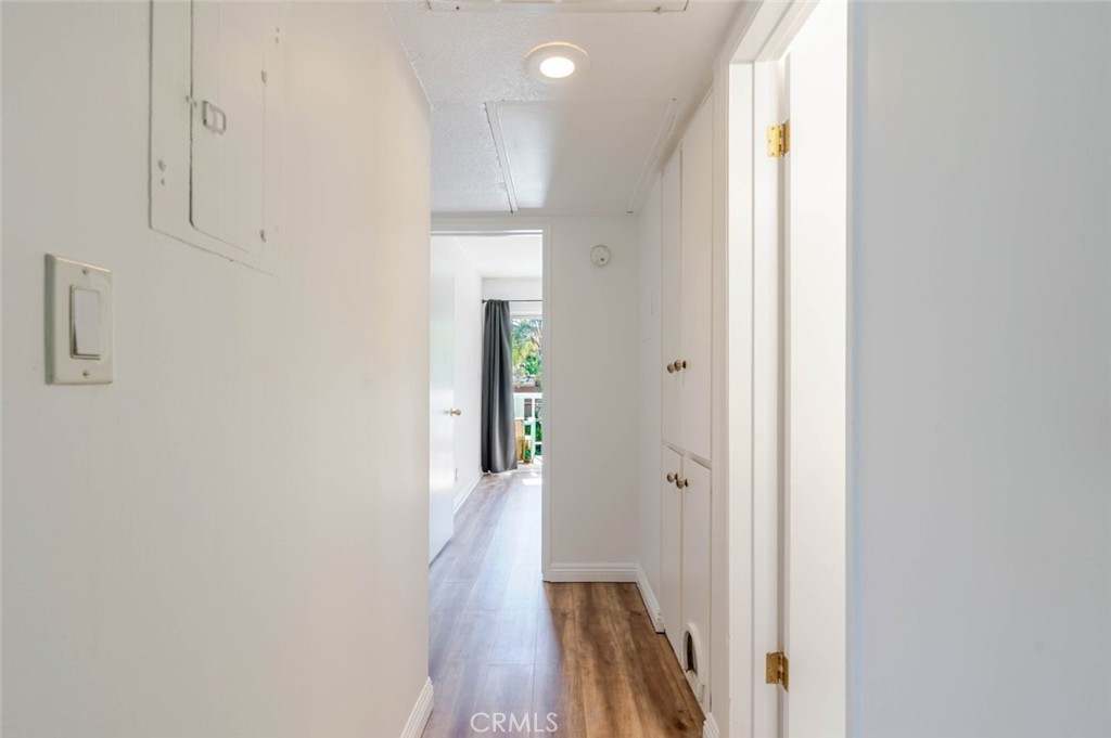 13543 Moorpark Street, Unit 7 Sherman Oaks, CA 91423 - Photo 13 of 25 a view of a hallway with wooden floor