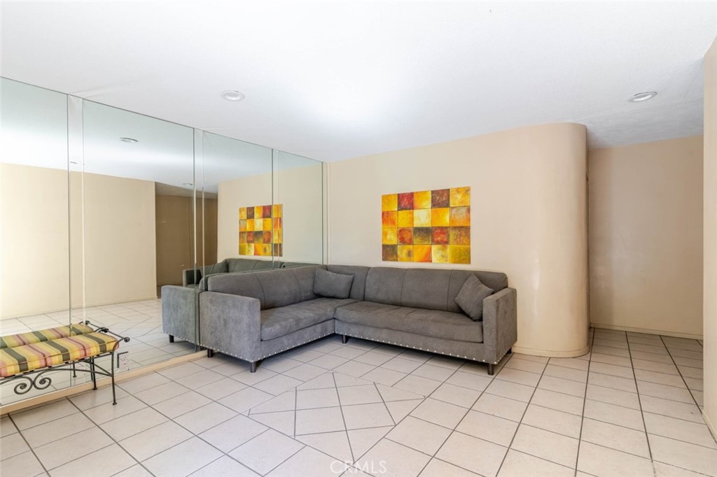 13543 Moorpark Street, Unit 7 Sherman Oaks, CA 91423 - Photo 16 of 25 a living room with furniture and a window