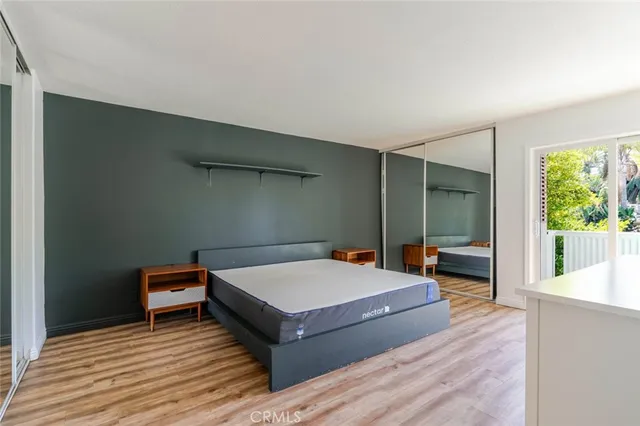 a bathroom with a sink a mirror and a toilet