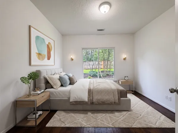 a bedroom with a bed and window