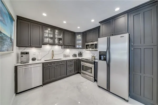 a kitchen with a sink and cabinets