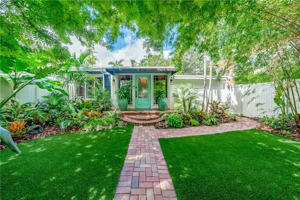 a backyard of a house with lots of green space