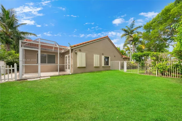a view of an house with backyard space and garden