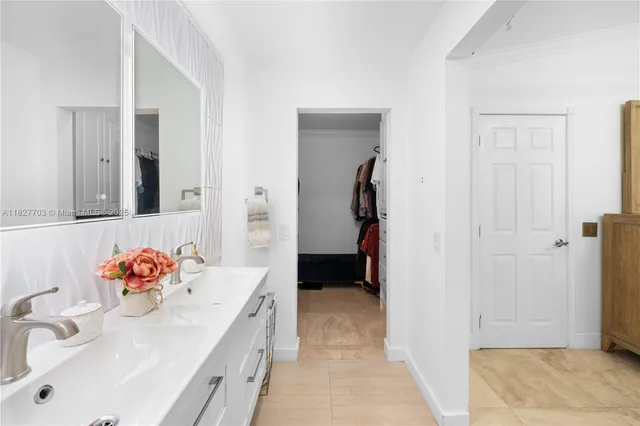 a bedroom with a bed and a view of bathroom