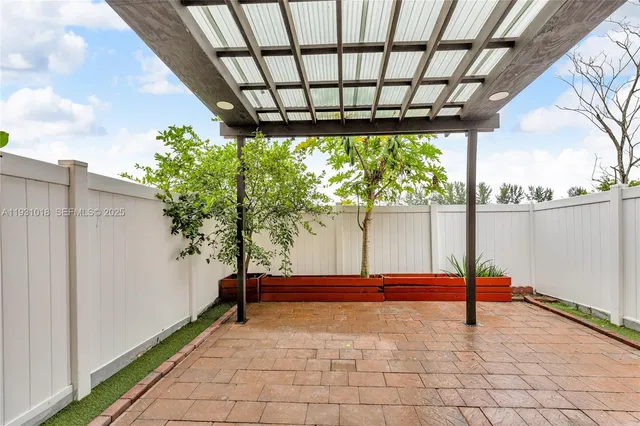a view of yard with wooden fence
