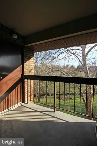 a view of a porch with a floor to ceiling window