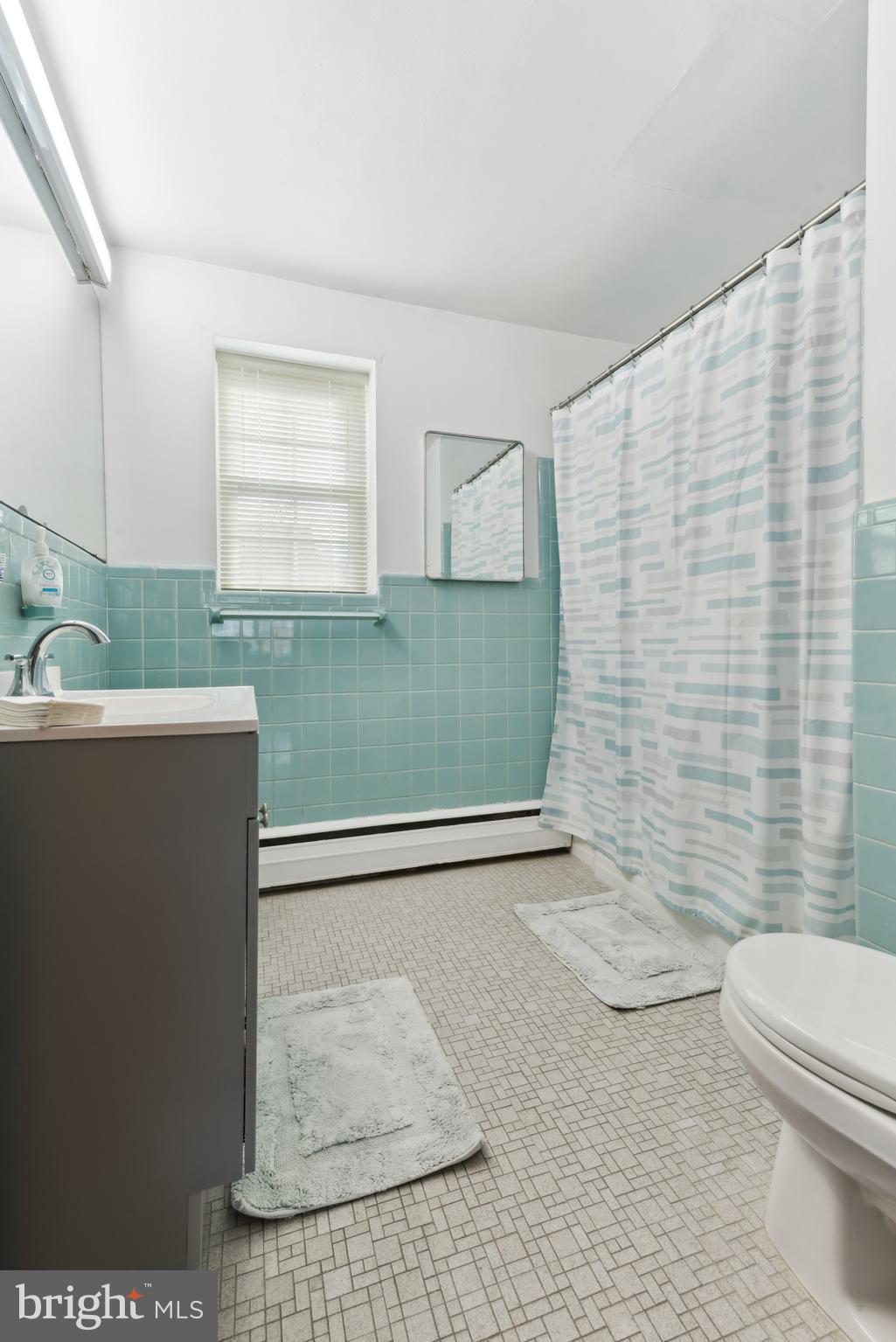 1334 Montgomery Avenue, Unit D3 Narberth, PA 19072 - Photo 8 of 15 a bathroom with a sink a toilet and shower