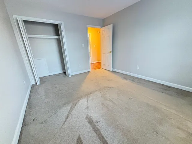 a bathroom with a sink toilet a mirror and shower