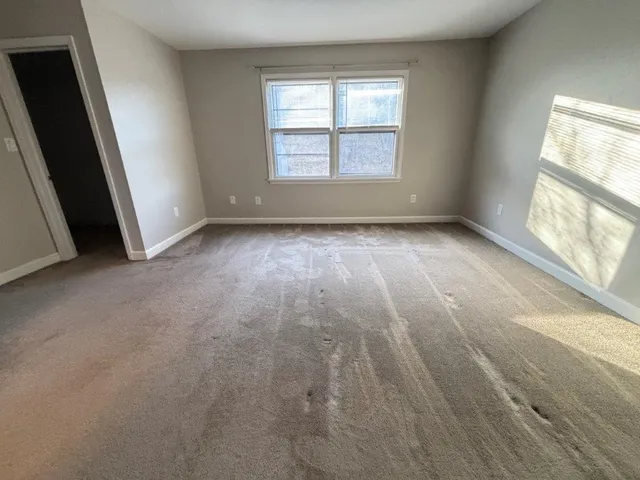 an empty room with windows