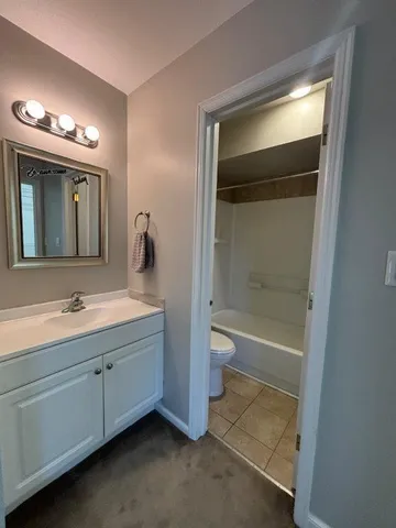 a bathroom with a toilet and a bathtub