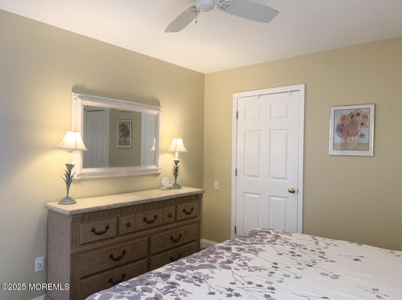 15 9th Avenue, Unit UPPR Seaside Park, NJ 08752 - Photo 11 of 24 a bathroom with a sink and a mirror