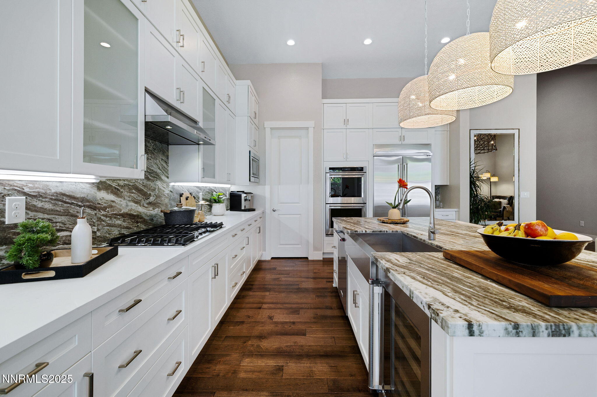 709 West Pleasant Oak Trail Reno, NV 89511 - Photo 16 of 44 a large kitchen with stainless steel appliances lots of counter space and wooden floor