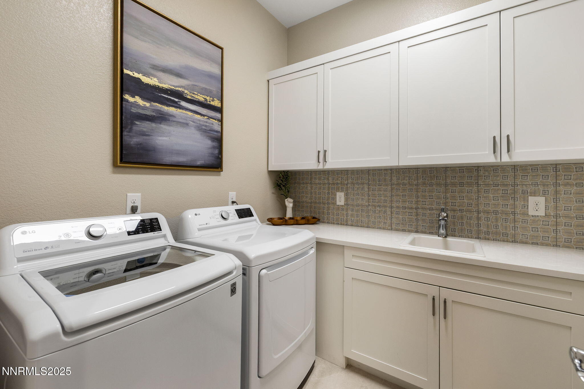 709 West Pleasant Oak Trail Reno, NV 89511 - Photo 34 of 44 a view of storage and utility room with washer and dryer
