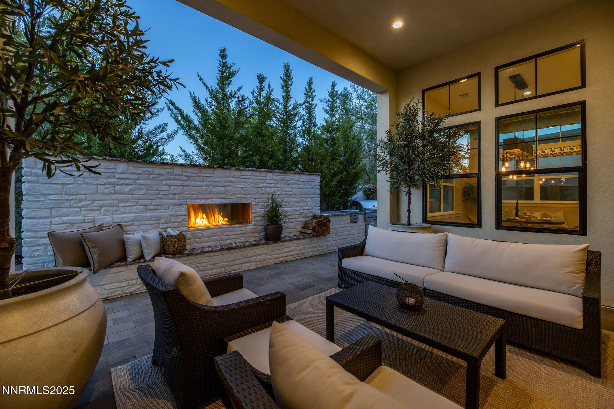 709 West Pleasant Oak Trail Reno, NV 89511 - Photo 37 of 44 a outdoor living space with furniture and a fireplace