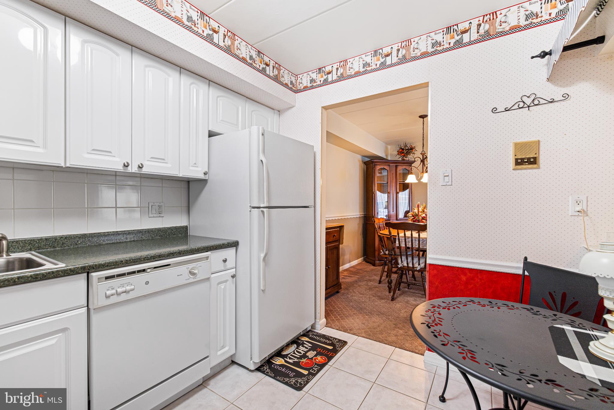 64003 Delaire Landing Road, Unit 3 Philadelphia, PA 19114 - Photo 7 of 16 Charming kitchen with inviting dining access.