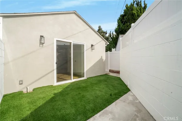 a backyard of a house with seating space