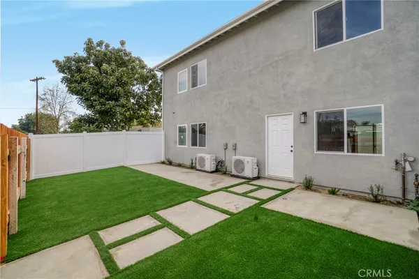 a view of yard with swimming pool and green space
