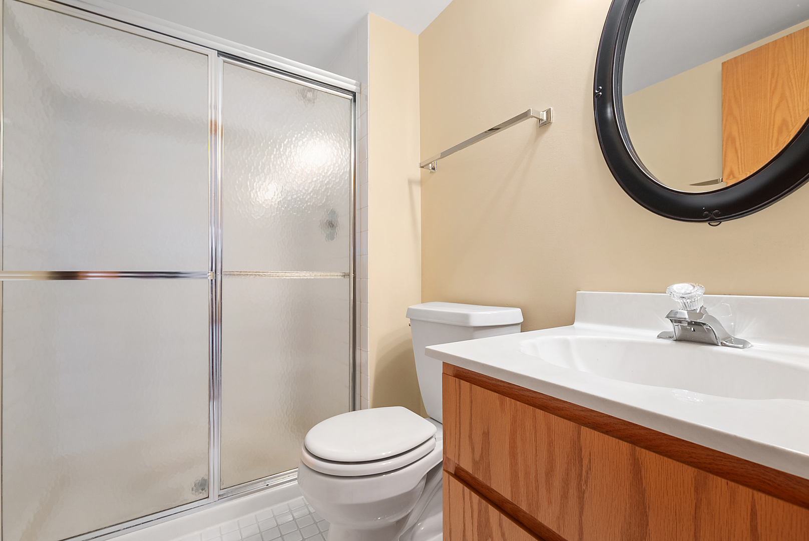 7811 West 157th Street, Unit 1N Orland Park, IL 60462 - Photo 13 of 18 a bathroom with a sink and a mirror