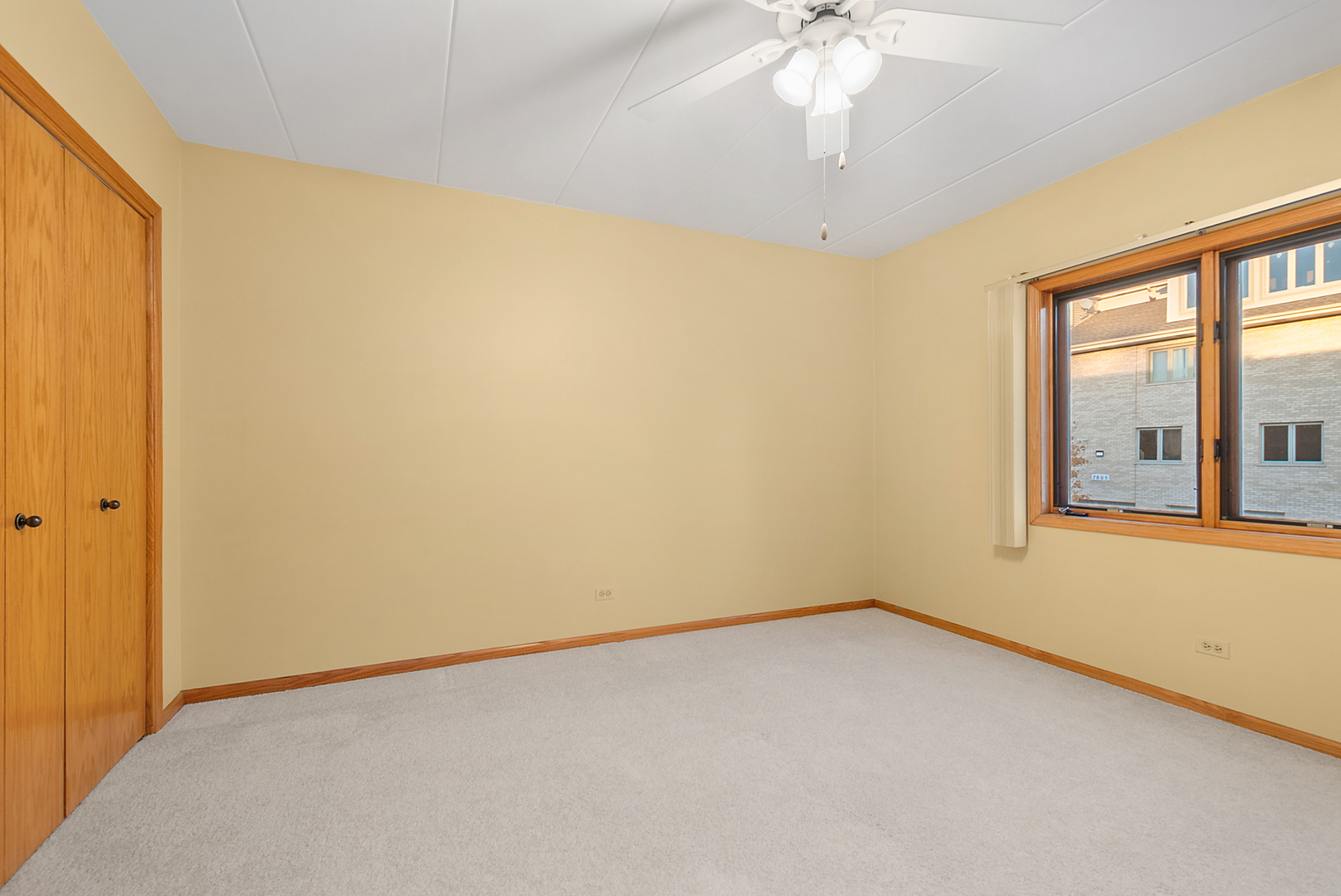 7811 West 157th Street, Unit 1N Orland Park, IL 60462 - Photo 14 of 18 a view of an empty room with a window