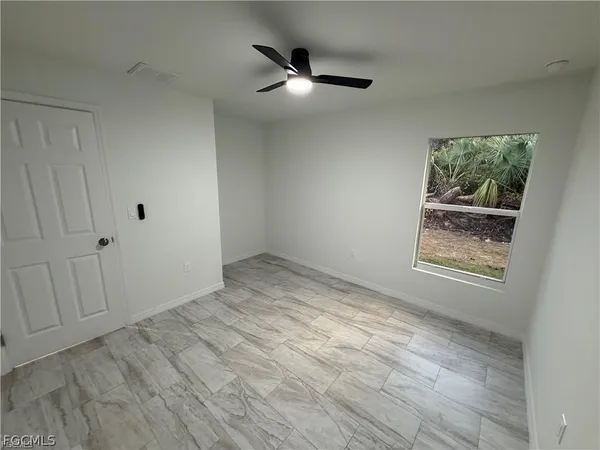 a view of an empty room and window