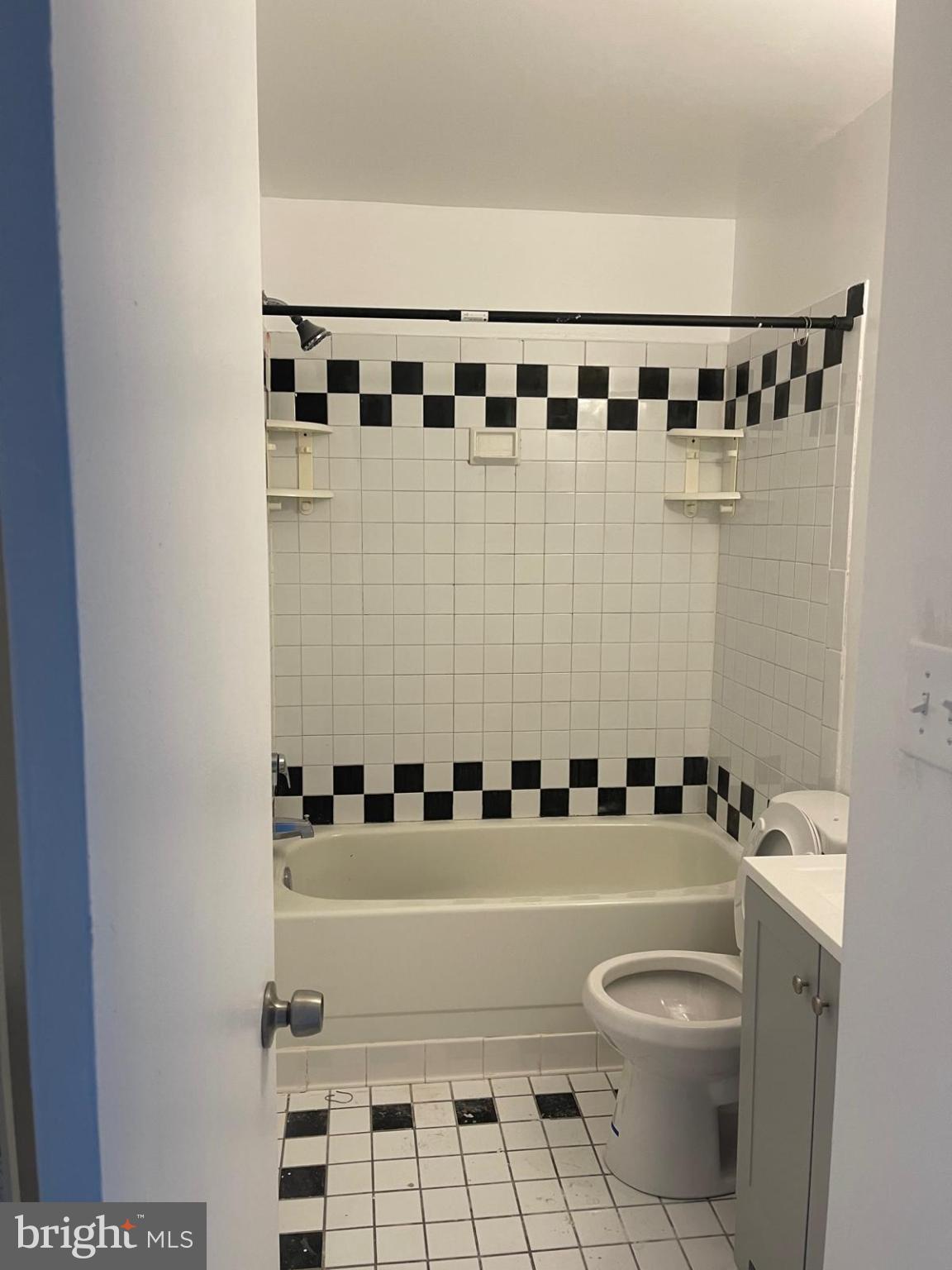 2824 Chablis Circle, Unit 7 Woodbridge, VA 22192 - Photo 8 of 11 Classic black and white tiled bathroom retreat.