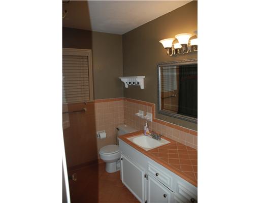 626 Pasadena Place Corpus Christi, TX 78411 - Photo 7 of 10 a bathroom with a sink a toilet and shower